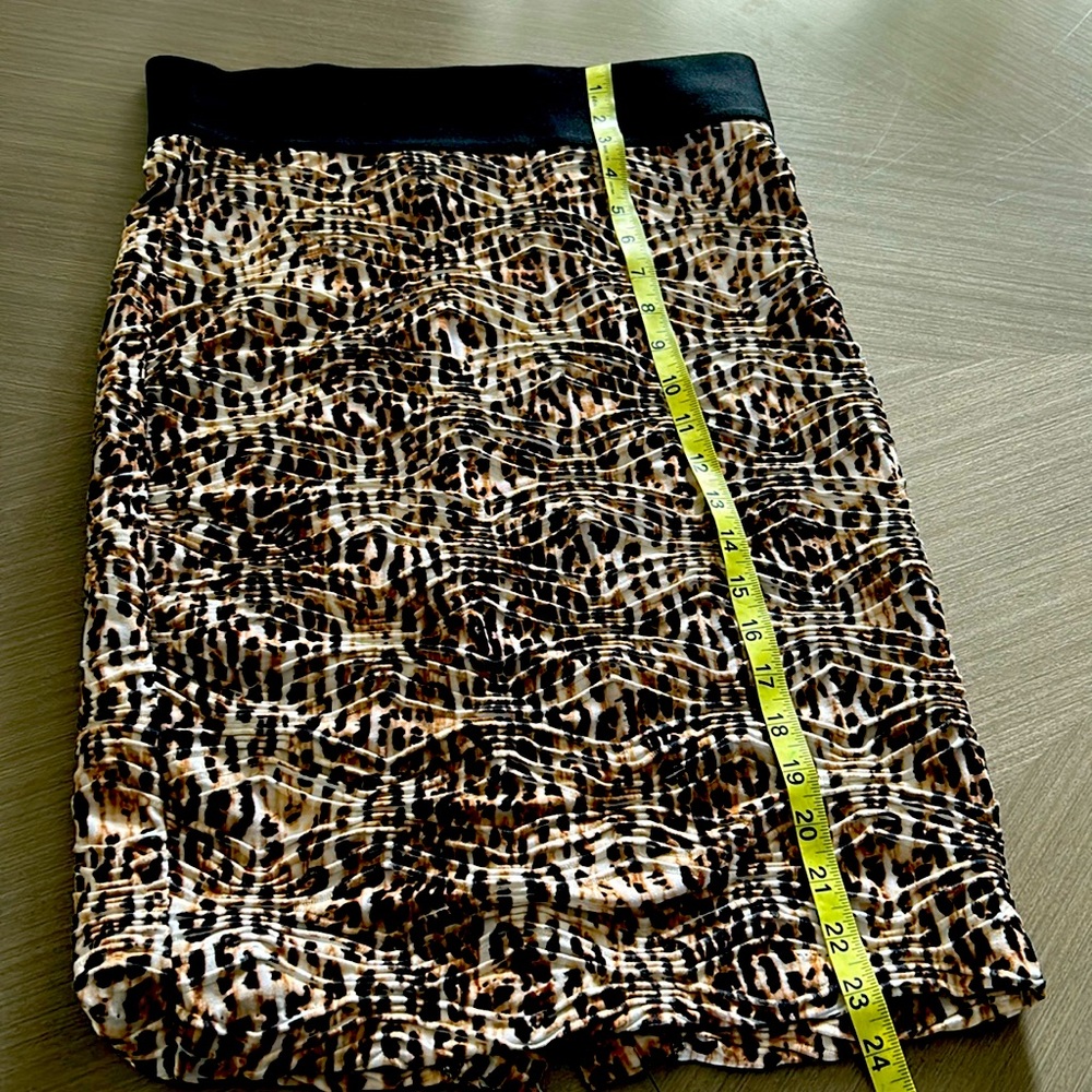Inc mid length leopard print skirt with wide band.